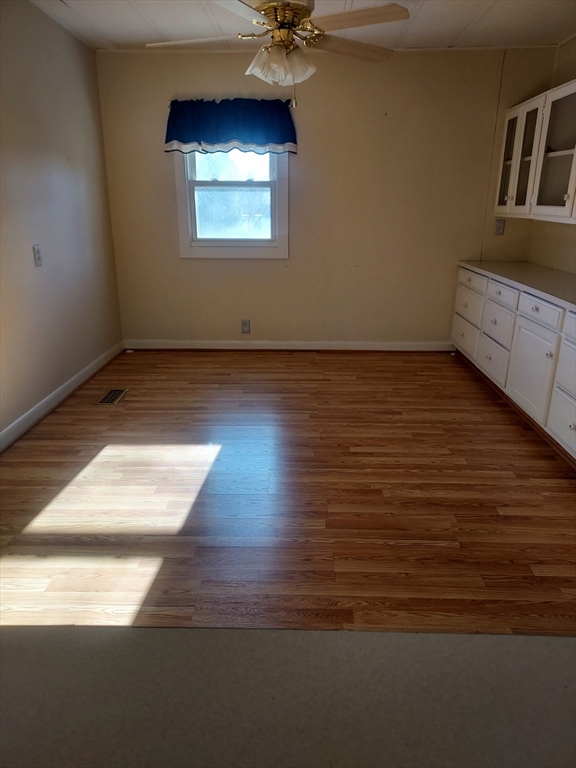 2 Upland Road Taunton, MA 02780 - Photo 11 of 21 a view of a room with wooden floor and a ceiling fan