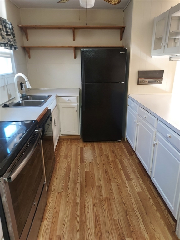 2 Upland Road Taunton, MA 02780 - Photo 15 of 21 a kitchen with a refrigerator and a stove