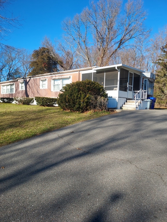 2 Upland Road Taunton, MA 02780 - Photo 2 of 21 a view of a street with a house and a road