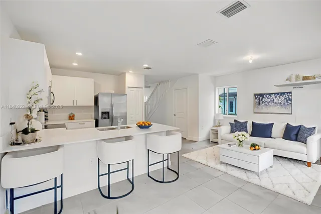 a living room with furniture and a table