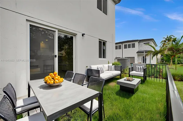 a outdoor living space with furniture and garden view