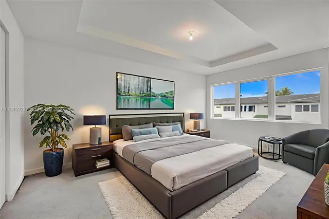 a bedroom with bed and a couch