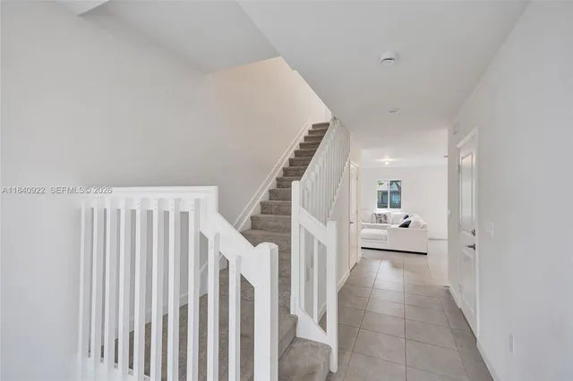 a view of entryway with furniture and wooden floor