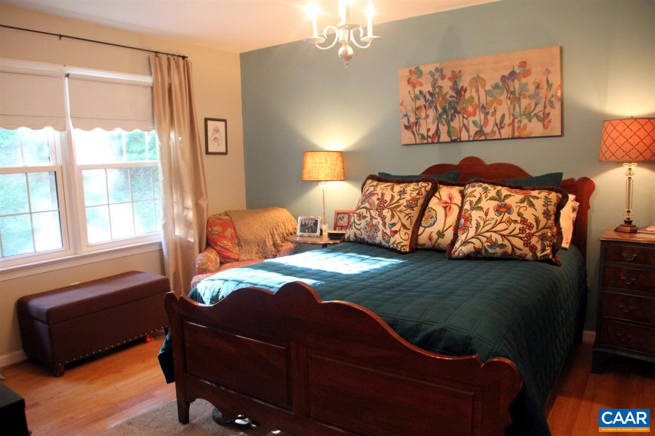 88 Good Hope Church Road Aroda, VA 22709 - Photo 16 of 30 a bed sitting in a bedroom next to a window