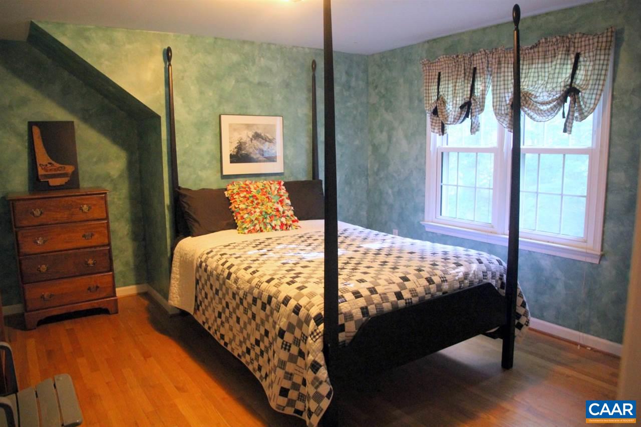 88 Good Hope Church Road Aroda, VA 22709 - Photo 20 of 30 a bed sitting in a bedroom next to a window