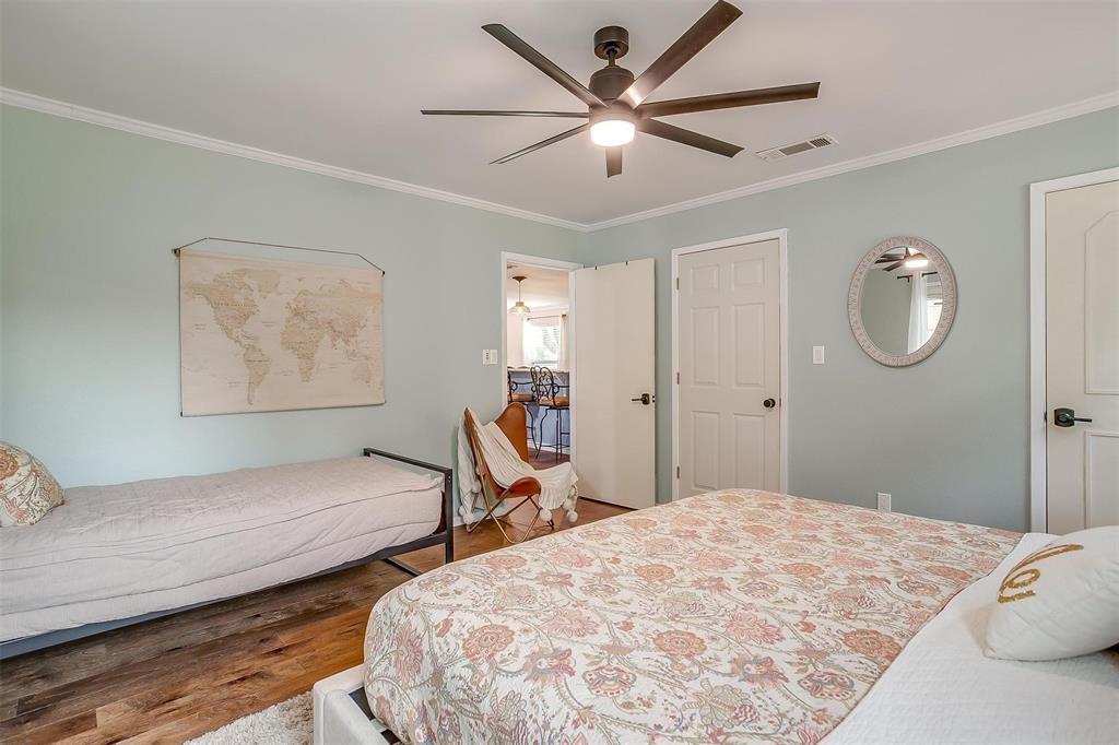 520 Deer Trail Gordon, TX 76453 - Photo 11 of 40 Bedroom with wood finished floors, crown molding, and ceiling fan