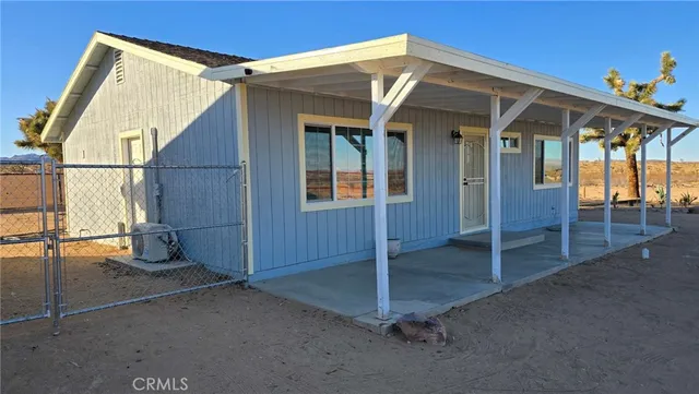 a view of a house with a snow