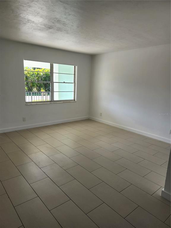 2921 Vasco Street, Unit B Punta Gorda, FL 33950 - Photo 3 of 10 an empty room with a window