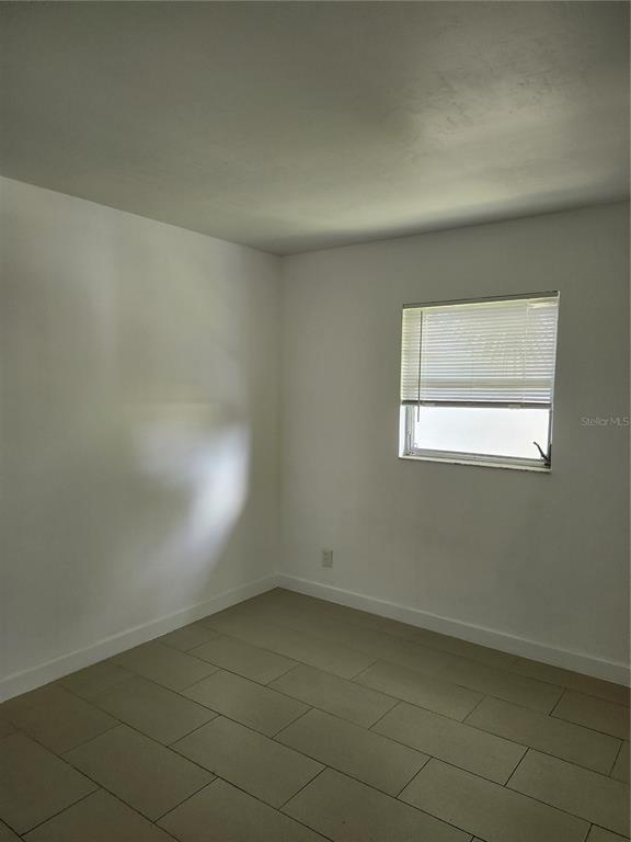 2921 Vasco Street, Unit B Punta Gorda, FL 33950 - Photo 6 of 10 an empty room with a window