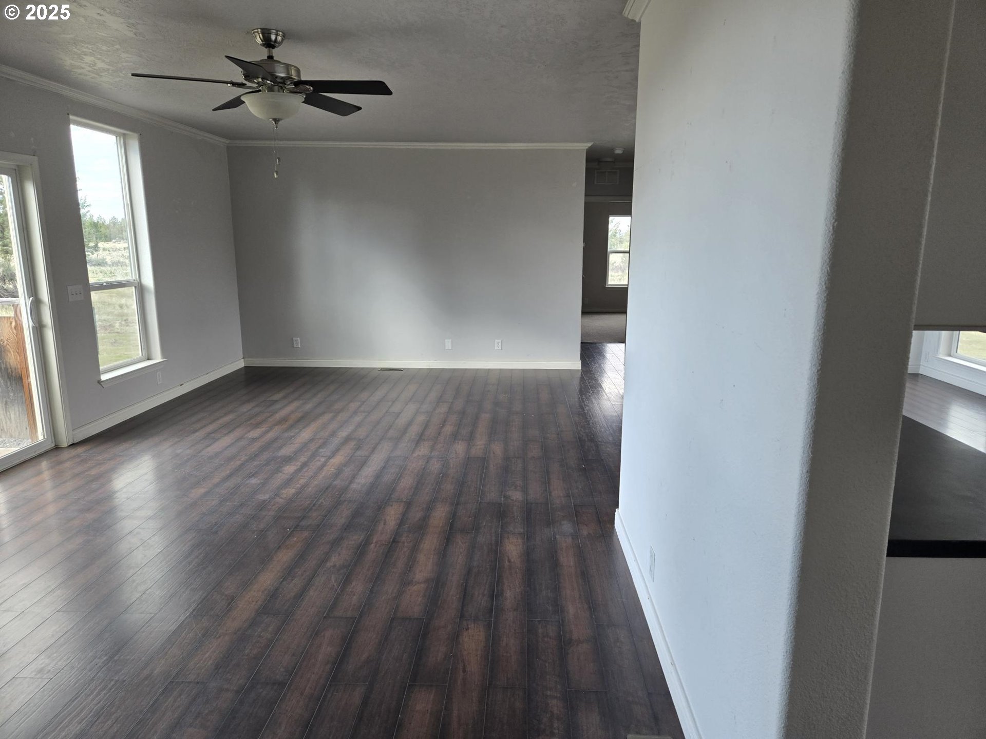9290 Southwest 3115th Road Culver, OR 97734 - Photo 7 of 21 wooden floor in an empty room with a window