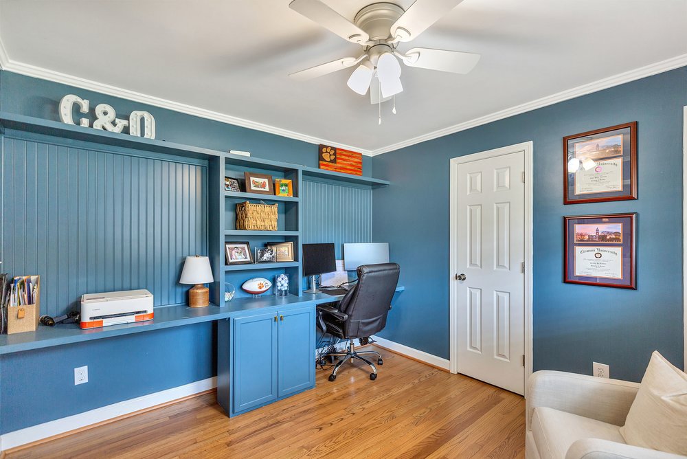 2310 Hannah Road Anderson, SC 29621 - Photo 16 of 32 Custom built-in shelving and a spacious desk define this functional home office.