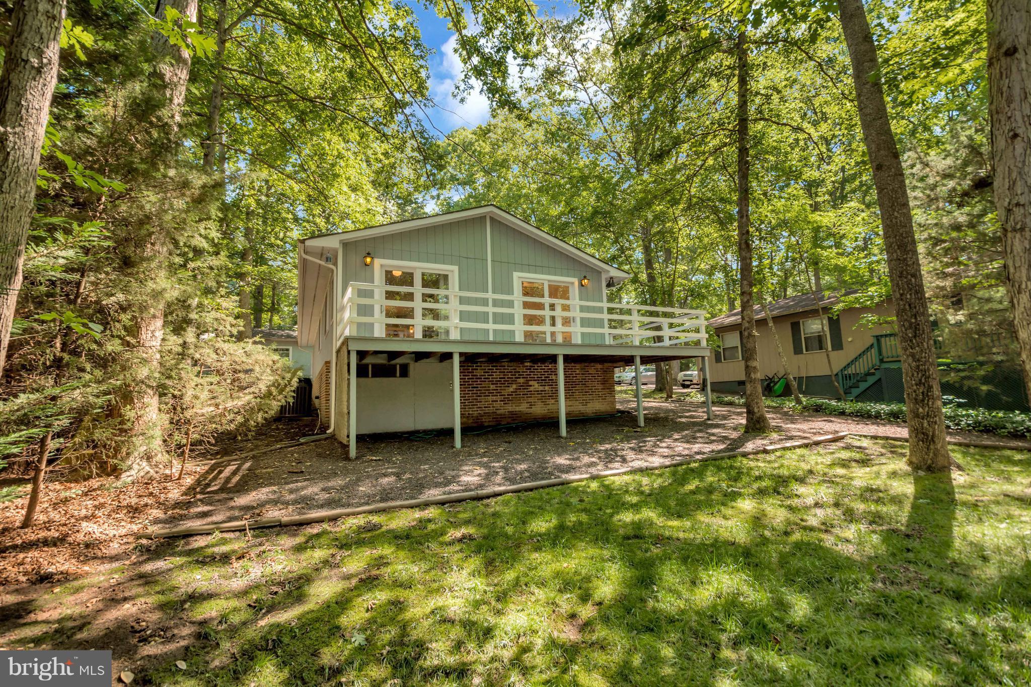105 Greenspring Road Locust Grove, VA 22508 - Photo 11 of 30 Large trees shade the home from the summer sun