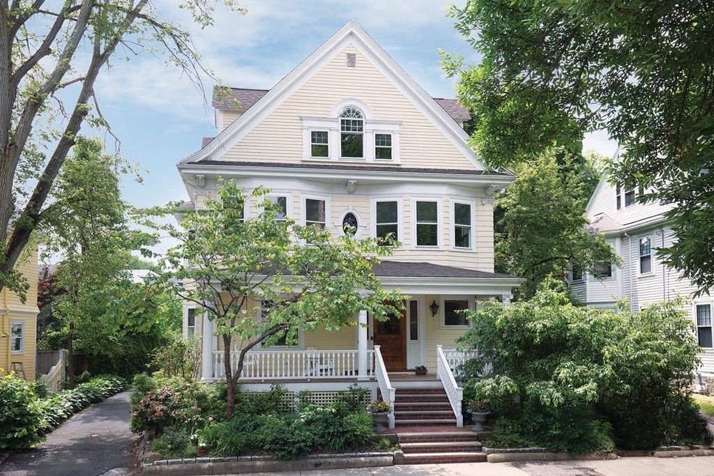 14 Milton Road Brookline, MA 02445 - Photo 1 of 10 a front view of a house with a yard and trees