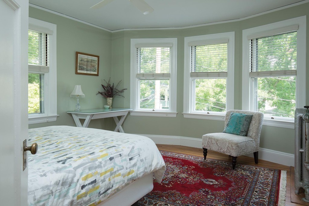 14 Milton Road Brookline, MA 02445 - Photo 8 of 10 a bedroom with a bed and a couch