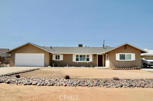 12790 Pocono Road Apple Valley, CA 92308 - Photo 1 of 1 a front view of a house with a yard