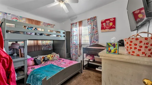 a view of a patio with table and chairs near a yard