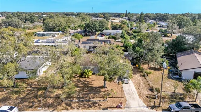 a view of a kitchen with workspace and a window