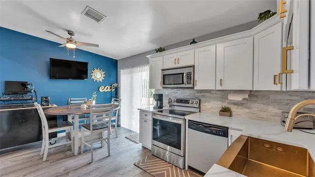 a view of hallway with wooden floor