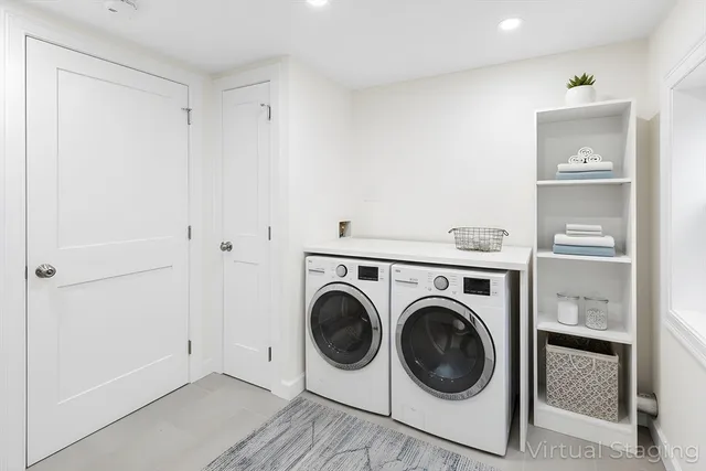 a utility room with sink dryer and washer