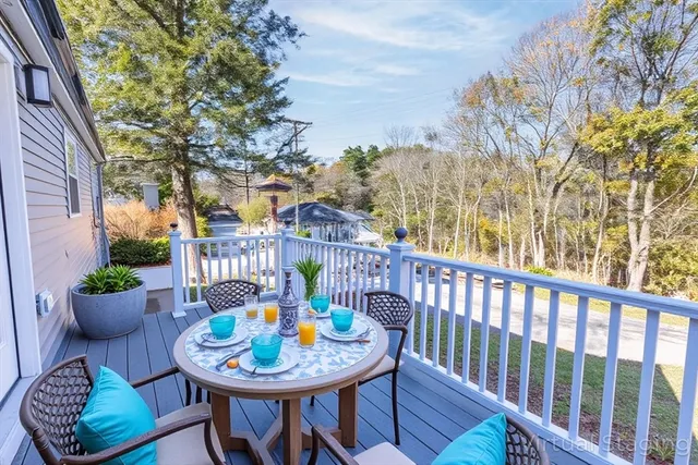 a view of a chair and table in backyard