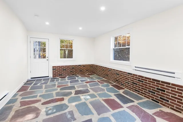 a view of a room with a black and white checkered floor