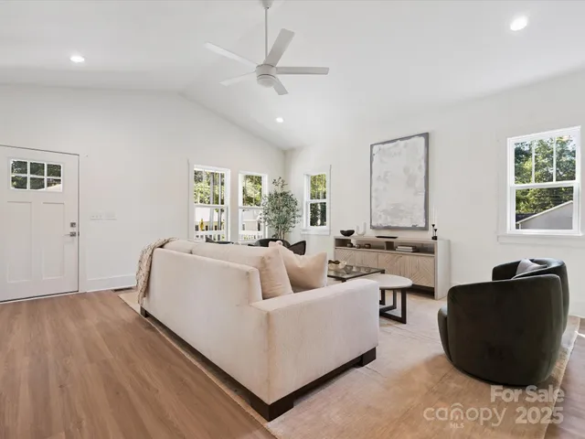 a living room with furniture and a window
