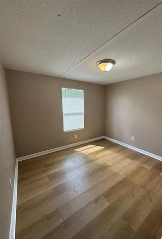 an empty room with a empty space and window