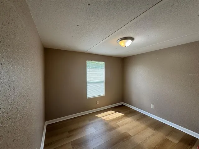 an empty room with a empty space and window