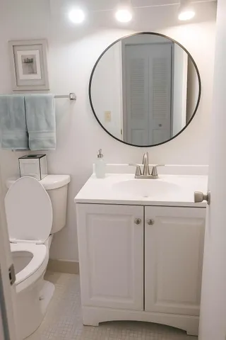 a view of a chairs and table in a balcony