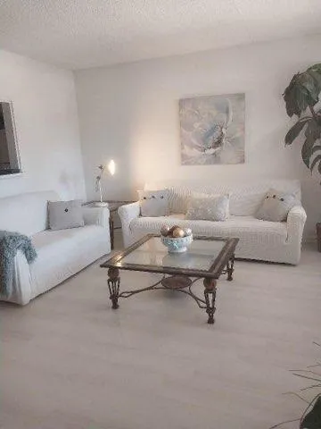 a living room with furniture and a couch