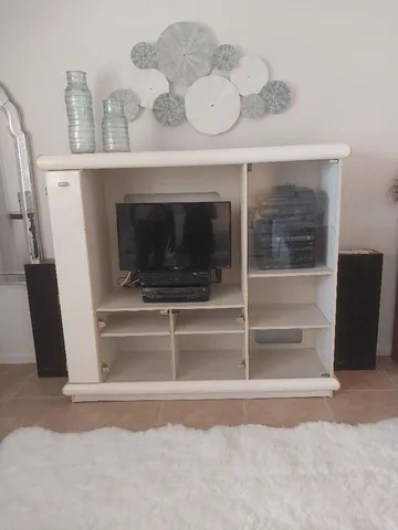 a kitchen with white cabinets appliances and sink