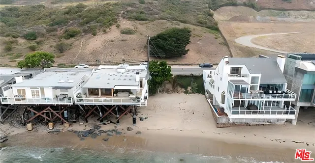 a view of multiple houses with outdoor space and lake view
