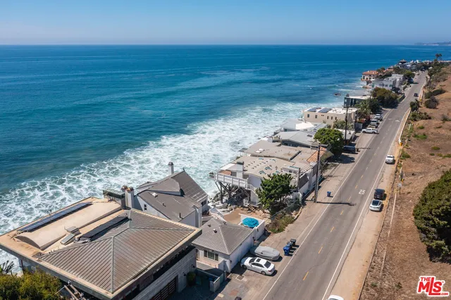 a view of swimming pool with outdoor seating