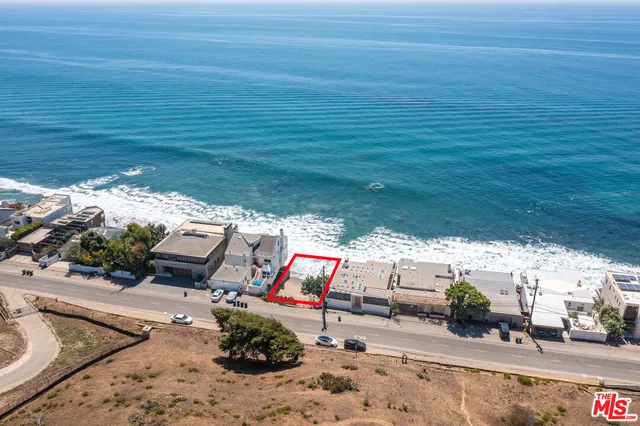 a balcony view with large trees