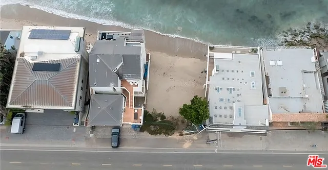 an aerial view of a house with a balcony