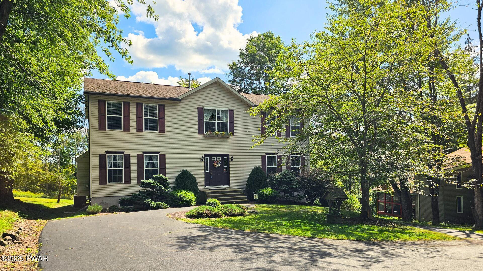 66 Boulder Road Lake Ariel, PA 18436 - Photo 1 of 51 a front view of a house with a yard