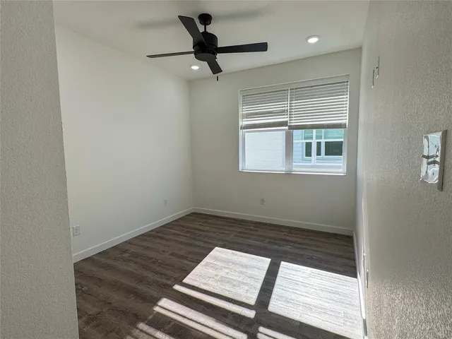 a view of an empty room and a window
