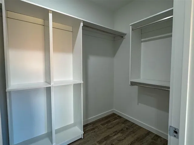 a view of an empty walk in closet