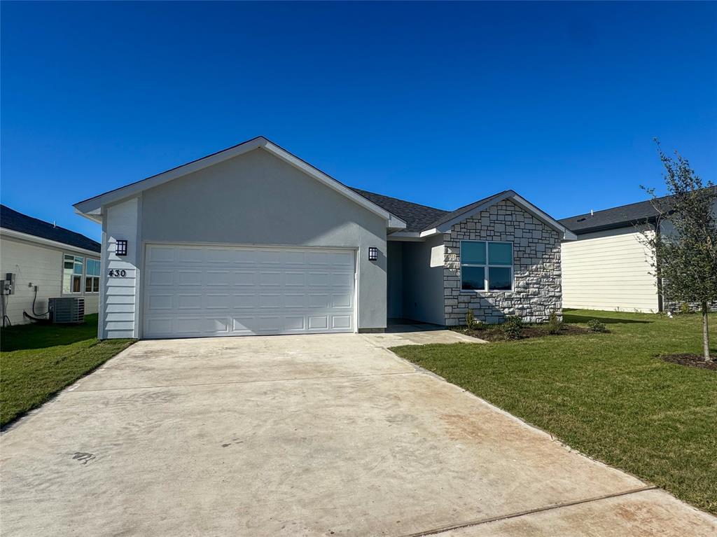 430 Lucy Road Greenville, TX 75402 - Photo 3 of 17 a front view of a house with a yard and garage