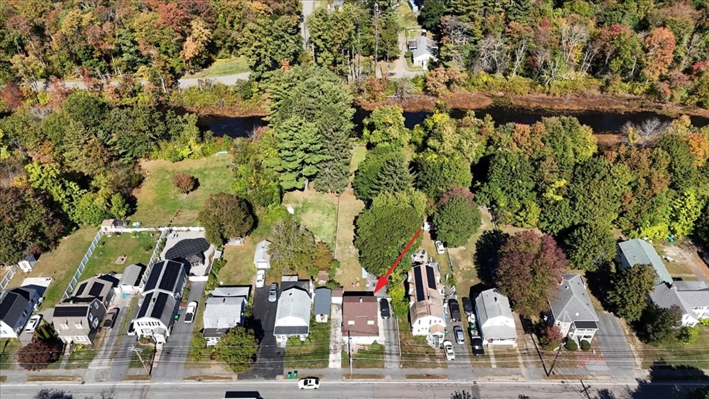203 Pleasant Street Ashland, MA 01721 - Photo 11 of 33 an aerial view of multi story residential apartment building with yard and parking space