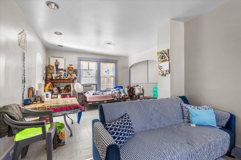 203 Pleasant Street Ashland, MA 01721 - Photo 17 of 33 a living room with furniture and a large window