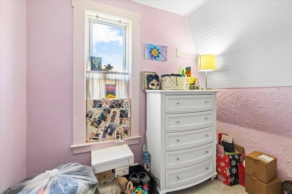 203 Pleasant Street Ashland, MA 01721 - Photo 23 of 33 a bedroom with a bed and a dresser