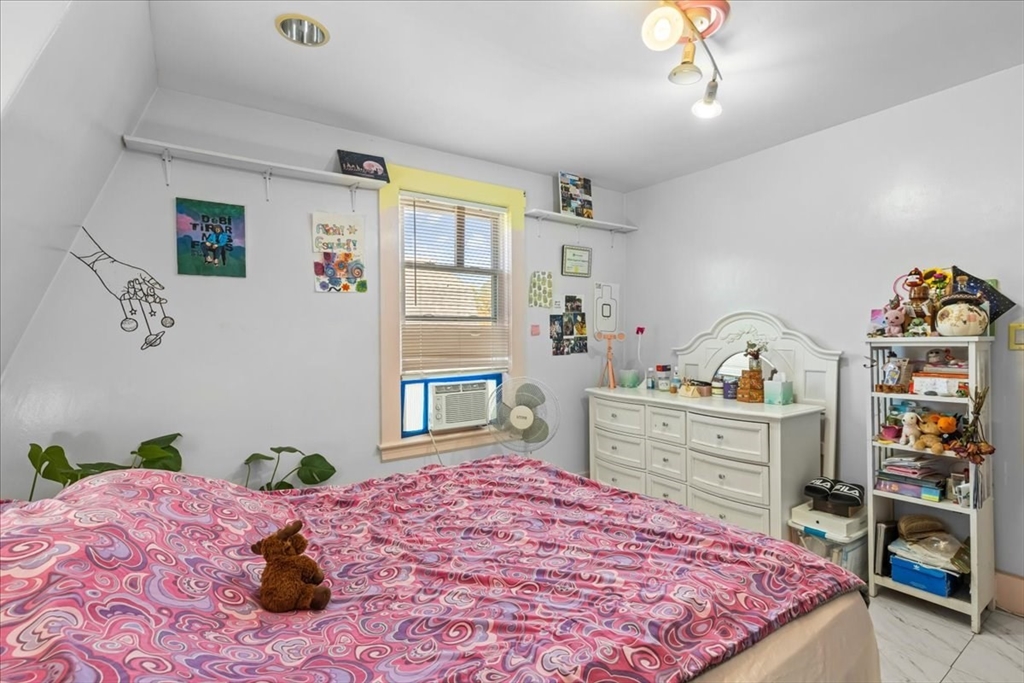 203 Pleasant Street Ashland, MA 01721 - Photo 25 of 33 a bed room with a bed and a dresser