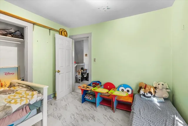 a bathroom with a sink mirror vanity and toilet