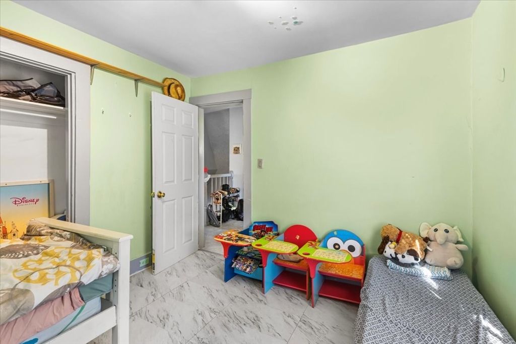 203 Pleasant Street Ashland, MA 01721 - Photo 27 of 33 a bedroom with a bed and a couch