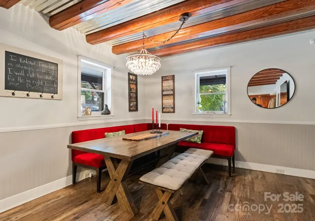 a dining room with furniture and window