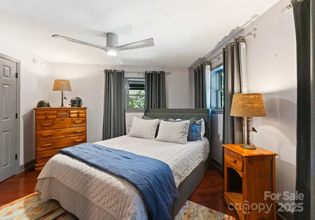 a bedroom with a bed and dresser