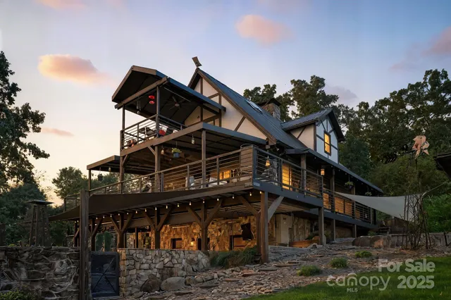 a front view of a house with a mountain