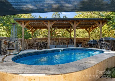 a view of a swimming pool with a patio