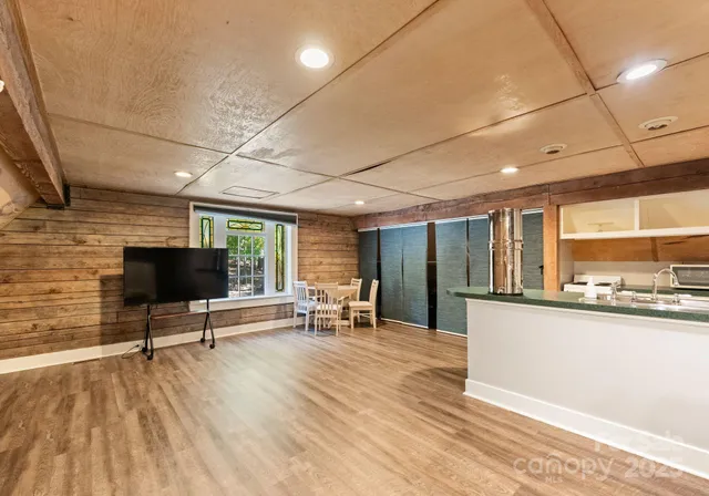 a view of a room with window and wooden floor